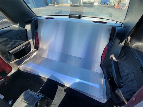 Disengage the rear seat cushion from the retainers by pushing the cushion rearward and then lifting and removing the seat bottom. . Foxbody rear seat delete